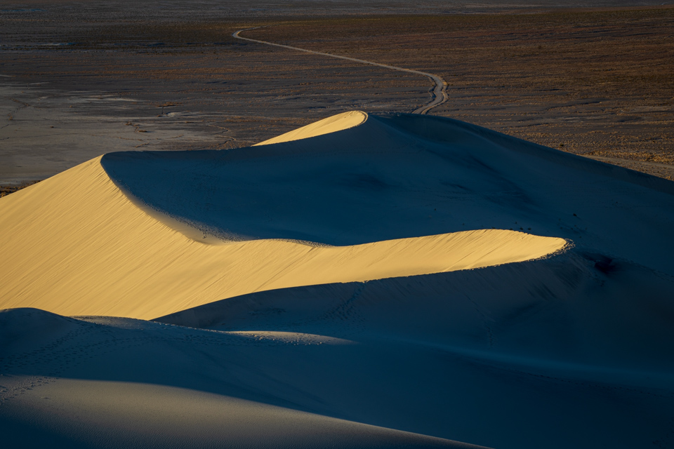 Dunes Lead to Road in Death Valley, California