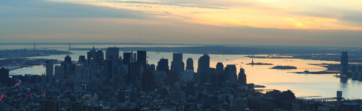 Sunset Over Statue of Liberty - Panorama in New York, New York